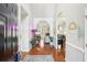 Inviting front entry showcases hardwood floors and decorative archways at 1010 Capella Creek Way, Grayson, GA 30017