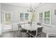 Cozy eat-in kitchen featuring backyard views through bright windows and a modern lighting fixture at 1010 Capella Creek Way, Grayson, GA 30017