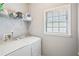 Functional laundry room equipped with modern appliances and storage shelves, making chores easier at 1010 Capella Creek Way, Grayson, GA 30017