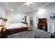 Spacious bedroom featuring tray ceilings, recessed lighting, desk and work space at 1010 Capella Creek Way, Grayson, GA 30017