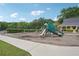 Community playground featuring a slide, swings, and picnic tables at 1010 Capella Creek Way, Grayson, GA 30017
