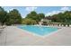 Spacious community pool area surrounded by lounge chairs and lush greenery at 1010 Capella Creek Way, Grayson, GA 30017