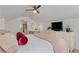Comfortable bedroom with a sitting area, dresser with TV, and pink bedding at 1634 Glenwood Se Ave, Atlanta, GA 30316