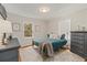 Cozy bedroom featuring hardwood floors, neutral paint, and a comfortable queen-sized bed at 1634 Glenwood Se Ave, Atlanta, GA 30316