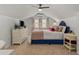 A bedroom features a stylish blue bed, matching curtains, and a ceiling fan at 1634 Glenwood Se Ave, Atlanta, GA 30316