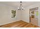 Bright dining room featuring hardwood floors and crown molding with an open doorway to the kitchen area at 1634 Glenwood Se Ave, Atlanta, GA 30316