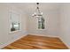 Elegant dining room with hardwood floors, crown molding, and a stylish chandelier, creating an inviting space at 1634 Glenwood Se Ave, Atlanta, GA 30316
