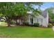 Charming single-story home with a well-manicured lawn and mature trees, offering great curb appeal and a welcoming entrance at 1634 Glenwood Se Ave, Atlanta, GA 30316