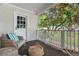 Charming front porch offering a cozy seating area with a view of the neighborhood and lush greenery at 1634 Glenwood Se Ave, Atlanta, GA 30316