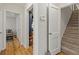 Hallway leading to living areas with hardwood floors and carpeted stairs at 1634 Glenwood Se Ave, Atlanta, GA 30316