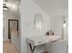 An upstairs hallway features a makeup vanity with accent mirror and lighting at 1634 Glenwood Se Ave, Atlanta, GA 30316