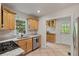 Charming kitchen featuring granite countertops, stainless steel appliances, and tile flooring at 1634 Glenwood Se Ave, Atlanta, GA 30316