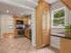Open kitchen view with stainless steel appliances and a large pantry for ample storage at 1634 Glenwood Se Ave, Atlanta, GA 30316