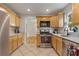 Bright kitchen featuring stainless steel appliances, granite countertops, and ample cabinet space at 1634 Glenwood Se Ave, Atlanta, GA 30316