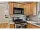 Modern kitchen featuring a stainless steel oven, subway tile backsplash, and granite countertops at 1634 Glenwood Se Ave, Atlanta, GA 30316