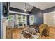 Well-lit living room featuring hardwood floors, vaulted ceilings, and a fireplace, ideal for modern living at 1634 Glenwood Se Ave, Atlanta, GA 30316