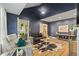 Cozy living room with stylish furnishings, a vaulted ceiling, and a view of the inviting front porch at 1634 Glenwood Se Ave, Atlanta, GA 30316
