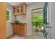 Mudroom area with custom cabinets and granite counters, providing storage and style as an entry to the outdoor patio at 1634 Glenwood Se Ave, Atlanta, GA 30316
