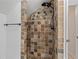 Walk-in shower with decorative tile surround, and a bronze shower head at 1634 Glenwood Se Ave, Atlanta, GA 30316