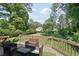 Inviting deck and backyard setting with outdoor seating, ideal for entertaining and enjoying the landscape at 1712 Shirley Sw St, Atlanta, GA 30310