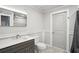 Updated bathroom with tiled floors, modern fixtures, and updated vanity at 1712 Shirley Sw St, Atlanta, GA 30310