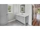 Modern bathroom with shaker-style vanity, quartz countertop, and LED mirror at 1712 Shirley Sw St, Atlanta, GA 30310