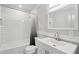 Updated bathroom with tiled shower and tub, and modern fixtures at 1712 Shirley Sw St, Atlanta, GA 30310