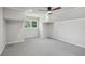 Neutral bedroom with angled walls, ceiling fan, and light gray carpet at 1712 Shirley Sw St, Atlanta, GA 30310