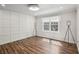 Bedroom featuring wood floors, ample lighting, and modern decor at 1712 Shirley Sw St, Atlanta, GA 30310