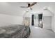 Bright bedroom with slanted ceilings, ceiling fan, and neutral carpet at 1712 Shirley Sw St, Atlanta, GA 30310