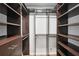Spacious walk-in closet with shelving and hanging rods for optimal organization and storage at 1712 Shirley Sw St, Atlanta, GA 30310