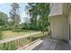 Wooden deck overlooking a lush green lawn and mature trees creating a peaceful outdoor retreat at 1712 Shirley Sw St, Atlanta, GA 30310