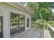 Exterior view featuring the home's deck and large sliding glass doors providing access to the outdoors at 1712 Shirley Sw St, Atlanta, GA 30310