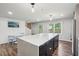 Well-lit kitchen featuring a large island, wood floors, and natural light at 1712 Shirley Sw St, Atlanta, GA 30310