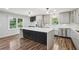 Modern kitchen with stainless steel appliances, white countertops, and a large center island at 1712 Shirley Sw St, Atlanta, GA 30310