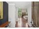 View of the living room with wood floors, and an open floor plan that leads to a brick fireplace at 1712 Shirley Sw St, Atlanta, GA 30310