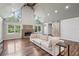 Spacious living area boasts vaulted ceilings, natural light, wood floors, and an open floor plan at 1712 Shirley Sw St, Atlanta, GA 30310