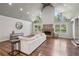 Spacious living room features high ceilings, lots of natural light, wood floors and a brick fireplace at 1712 Shirley Sw St, Atlanta, GA 30310