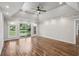 Large main bedroom with hardwood flooring, recessed lighting, and sliding glass doors at 1712 Shirley Sw St, Atlanta, GA 30310