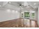 Spacious main bedroom featuring wood floors, recessed lighting, and tray ceiling at 1712 Shirley Sw St, Atlanta, GA 30310
