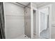 Updated shower with gray and white tile, and tiled shower floor at 1712 Shirley Sw St, Atlanta, GA 30310