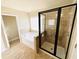 Bathroom featuring a separate shower, soaking tub and tile flooring at 2378 Misty Ivy Ct, Buford, GA 30519