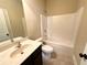 Bathroom with single sink vanity, and shower-tub combo with tile flooring at 2378 Misty Ivy Ct, Buford, GA 30519