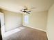 Neutral bedroom featuring carpeted flooring, a ceiling fan, and a window at 2378 Misty Ivy Ct, Buford, GA 30519