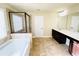 Main bathroom featuring a soaking tub, separate shower, and dual sink vanity at 2378 Misty Ivy Ct, Buford, GA 30519