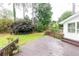 Spacious wooden deck overlooks a well-maintained lawn with mature trees and plants at 2730 Burtz Dr, Marietta, GA 30068