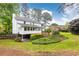 Expansive backyard featuring a well-maintained lawn and mature landscaping around a home at 2730 Burtz Dr, Marietta, GA 30068