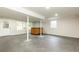 Finished basement space with concrete floor, bar, and natural light at 2730 Burtz Dr, Marietta, GA 30068