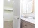 Bathroom with marble counter and gold fixtures adjacent to closet at 2730 Burtz Dr, Marietta, GA 30068