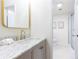 Elegant bathroom featuring marble countertop, gold fixtures, and tiled shower with glass doors at 2730 Burtz Dr, Marietta, GA 30068